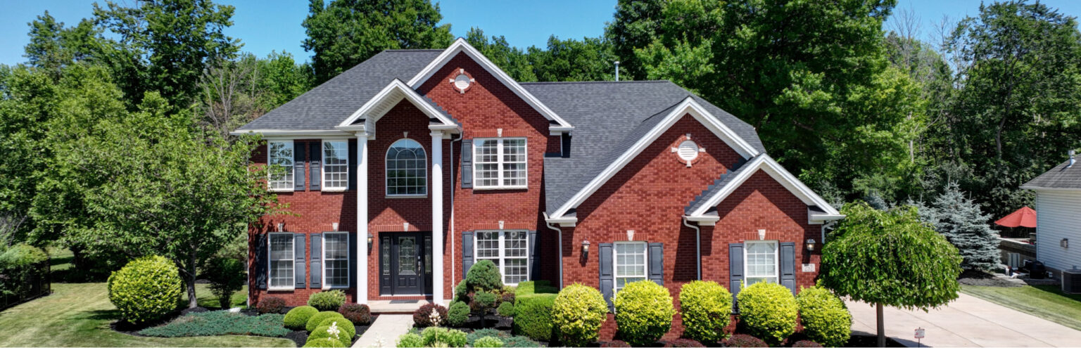 Modern red brick house with landscaped yard