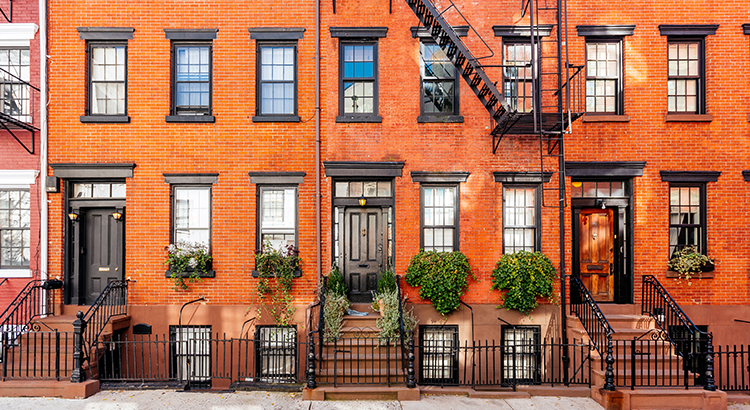 Brownstone townhouses facade in New York City, USA